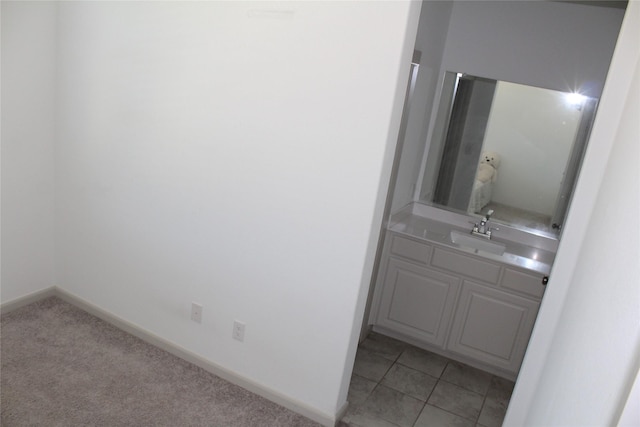 4804 Garner Dr, Carrollton, TX 75010 - bathroom featuring vanity, baseboards, and tile patterned flooring