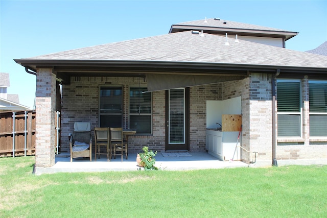 4804 Garner Dr, Carrollton, TX 75010 - rear view of property featuring a patio, roof with shingles, and brick siding
