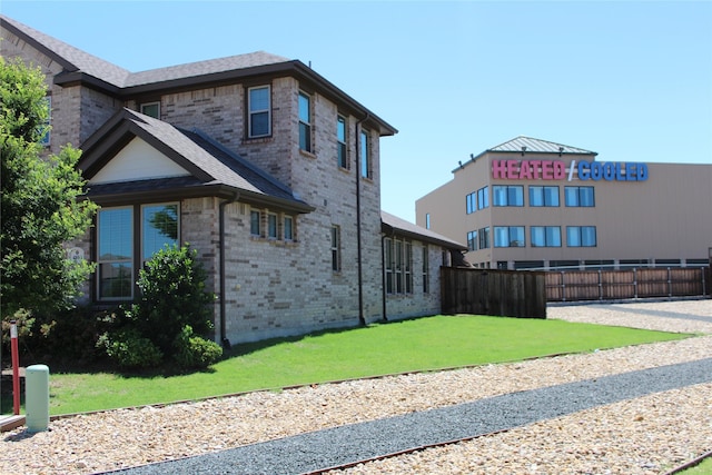 4804 Garner Dr, Carrollton, TX 75010 - view of home's exterior featuring brick siding and a shingled roof