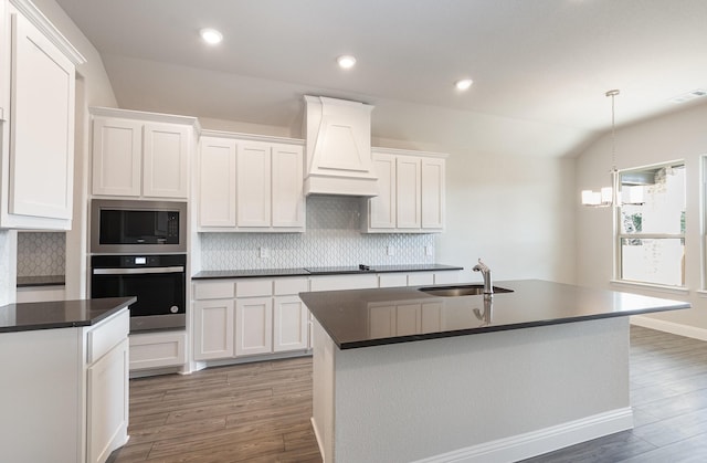 620 Alaina Dr, Desoto, TX 75115 - kitchen featuring appliances with stainless steel finishes, a sink, dark countertops, custom exhaust hood, and tasteful backsplash