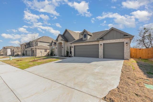 620 Alaina Dr, Desoto, TX 75115 - view of front of home with brick siding, a garage, concrete driveway, fence, and board and batten siding