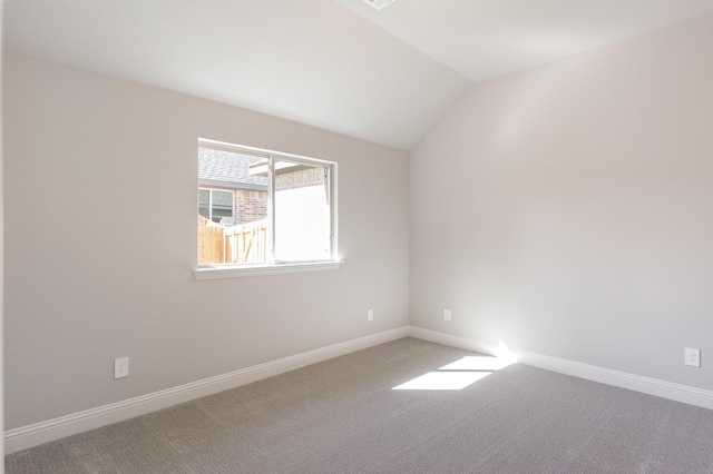 620 Alaina Dr, Desoto, TX 75115 - carpeted empty room with vaulted ceiling and baseboards