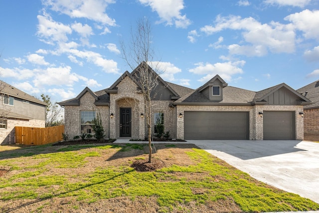 620 Alaina Dr, Desoto, TX 75115 - french country inspired facade with brick siding, a garage, driveway, board and batten siding, and a shingled roof