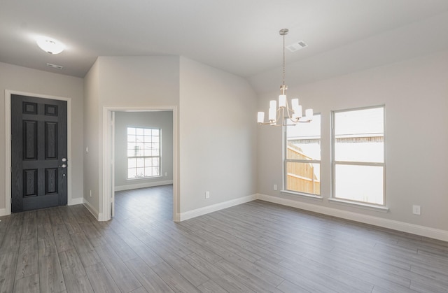 620 Alaina Dr, Desoto, TX 75115 - entrance foyer featuring a chandelier, baseboards, wood finished floors, and lofted ceiling