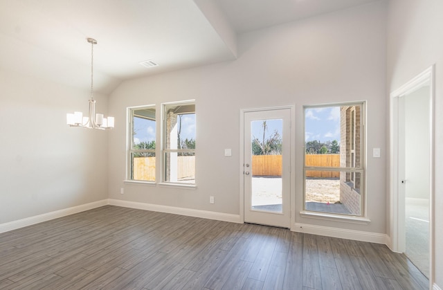 620 Alaina Dr, Desoto, TX 75115 - empty room with a chandelier, dark wood-style flooring, baseboards, and lofted ceiling