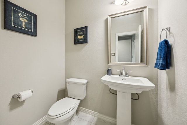 3120 Pioneer Path, Little Elm, TX 75068 - half bath with toilet, baseboards, and marble finish flooring
