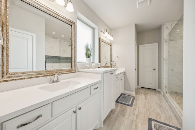 3120 Pioneer Path, Little Elm, TX 75068 - bathroom with a marble finish shower, marble finish floors, two vanities, and baseboards