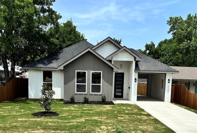 2539 Randolph St, Dallas, TX 75241 - view of front of property featuring driveway, roof with shingles, board and batten siding, and a carport