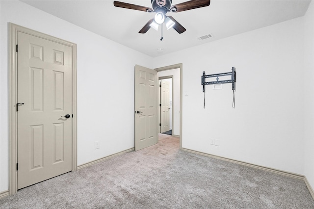 609 E Martin Ln, Sherman, TX 75090 - unfurnished bedroom featuring carpet flooring, baseboards, and a ceiling fan