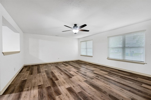 609 E Martin Ln, Sherman, TX 75090 - empty room featuring wood finished floors, ceiling fan, and baseboards