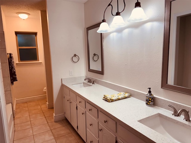 2000 Stacey Ct, Arlington, TX 76013 - full bathroom featuring tile patterned floors, double vanity, and toilet