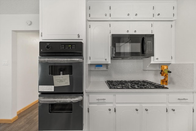 2000 Stacey Ct, Arlington, TX 76013 - kitchen with black appliances, white cabinets, dark wood-style flooring, light countertops, and baseboards