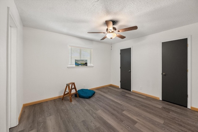 2000 Stacey Ct, Arlington, TX 76013 - spare room featuring a ceiling fan, wood finished floors, a textured ceiling, and baseboards