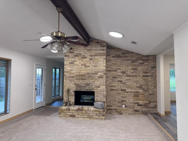 2000 Stacey Ct, Arlington, TX 76013 - unfurnished living room featuring a brick fireplace, a ceiling fan, a textured ceiling, brick wall, and carpet flooring