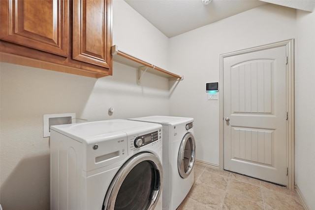 6824 San Fernando Dr, Fort Worth, TX 76131 - laundry room featuring washer and clothes dryer, cabinet space, baseboards, and light tile patterned flooring