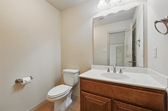 6824 San Fernando Dr, Fort Worth, TX 76131 - bathroom featuring toilet, vanity, baseboards, and tile patterned floors