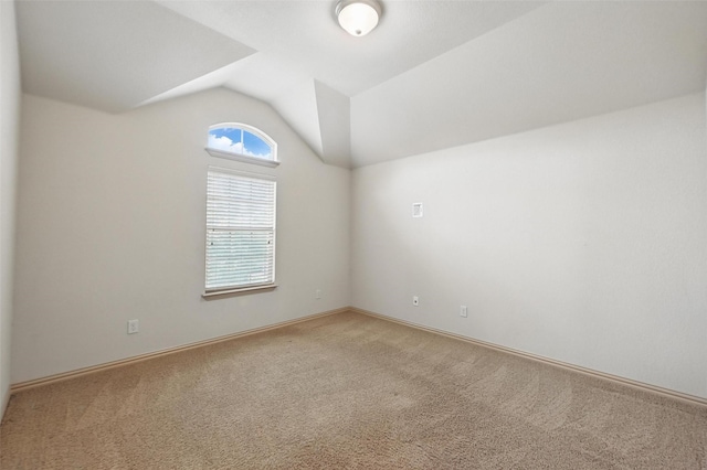 6824 San Fernando Dr, Fort Worth, TX 76131 - spare room featuring carpet floors, vaulted ceiling, and baseboards