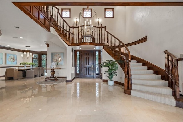 6908 Ridgewood Dr, Fort Worth, TX 76132 - entrance foyer featuring a chandelier, stairs, healthy amount of natural light, baseboards, and a towering ceiling