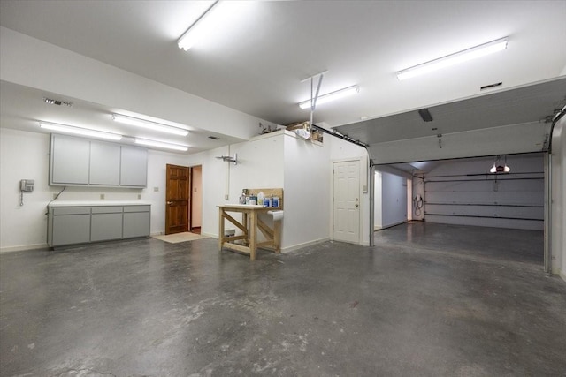 6908 Ridgewood Dr, Fort Worth, TX 76132 - garage featuring baseboards
