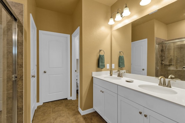 2420 Rooster Ln, Northlake, TX 76247 - full bathroom featuring a shower stall, double vanity, tile patterned flooring, and toilet