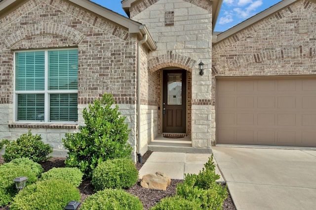 2420 Rooster Ln, Northlake, TX 76247 - doorway to property with driveway, an attached garage, stone siding, and brick siding