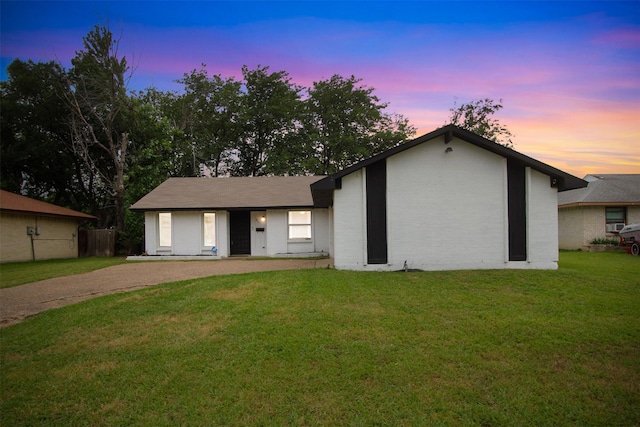 917 Park E Cir, Garland, TX 75043 - mid-century inspired home with a front yard, driveway, and brick siding