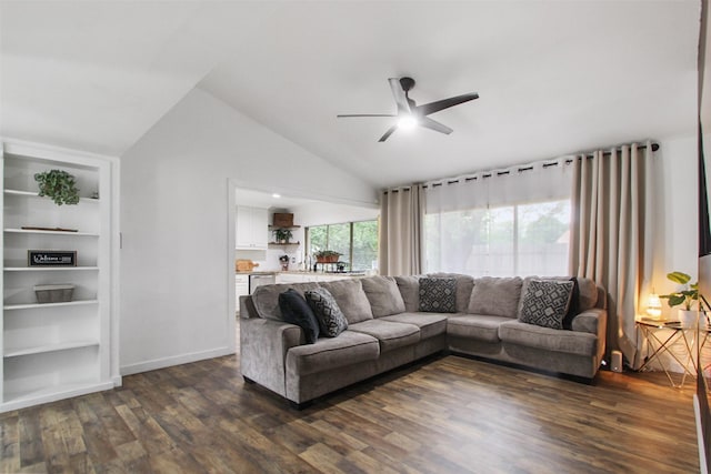 917 Park E Cir, Garland, TX 75043 - living area featuring a ceiling fan, dark wood-style floors, lofted ceiling, built in shelves, and baseboards