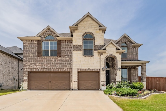 233 Honey Brook Ln, Aledo, TX 76008 - french country home featuring an attached garage, brick siding, driveway, stone siding, and fence