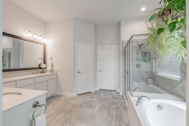 233 Honey Brook Ln, Aledo, TX 76008 - bathroom with a shower stall, vanity, a garden tub, and baseboards