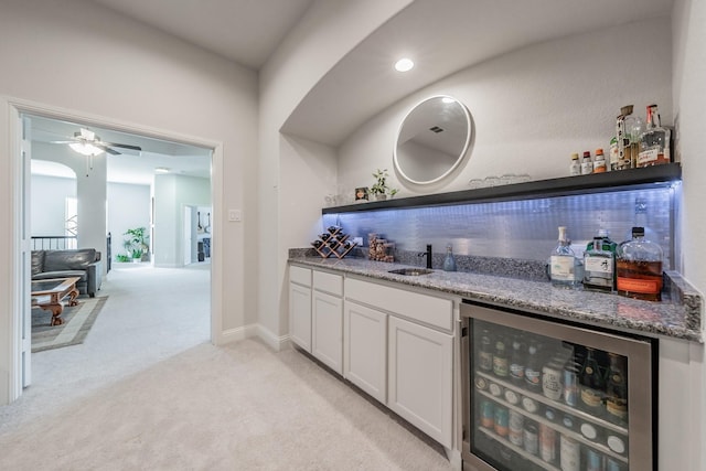 233 Honey Brook Ln, Aledo, TX 76008 - indoor wet bar with wine cooler, light colored carpet, and ceiling fan