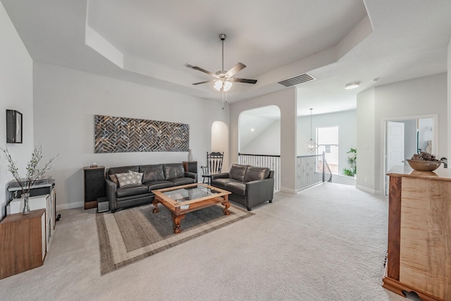 233 Honey Brook Ln, Aledo, TX 76008 - living area featuring a raised ceiling, light colored carpet, a ceiling fan, and baseboards