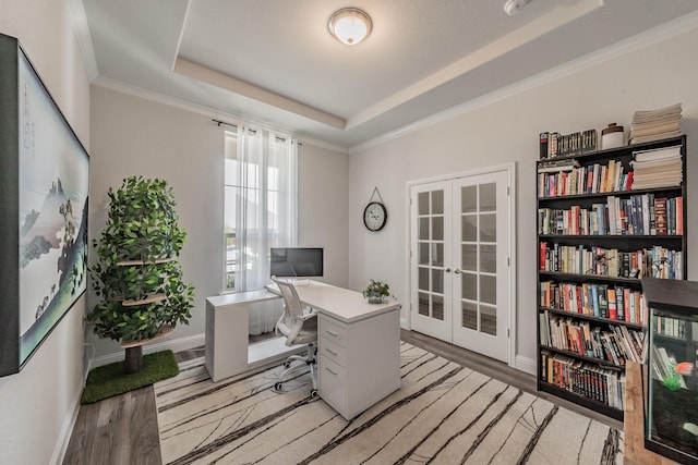 233 Honey Brook Ln, Aledo, TX 76008 - office area with french doors, light wood-style flooring, a tray ceiling, baseboards, and ornamental molding