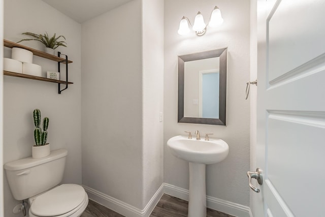 233 Honey Brook Ln, Aledo, TX 76008 - half bath featuring wood finished floors, toilet, and baseboards