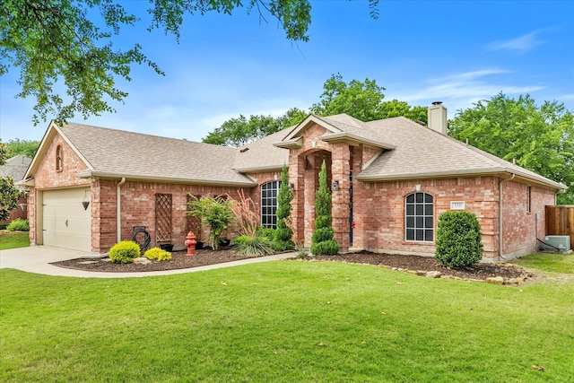 110 Stanford, Forney, TX 75126 - view of front of home featuring a shingled roof, a chimney, brick siding, and a front lawn