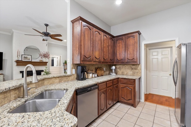 110 Stanford, Forney, TX 75126 - kitchen with appliances with stainless steel finishes, a sink, a ceiling fan, light tile patterned flooring, and tasteful backsplash
