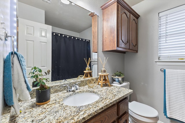 110 Stanford, Forney, TX 75126 - full bathroom featuring toilet, vanity, and a shower with shower curtain
