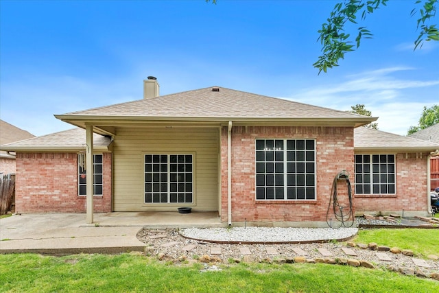 110 Stanford, Forney, TX 75126 - back of property featuring a patio area, a chimney, brick siding, and a shingled roof