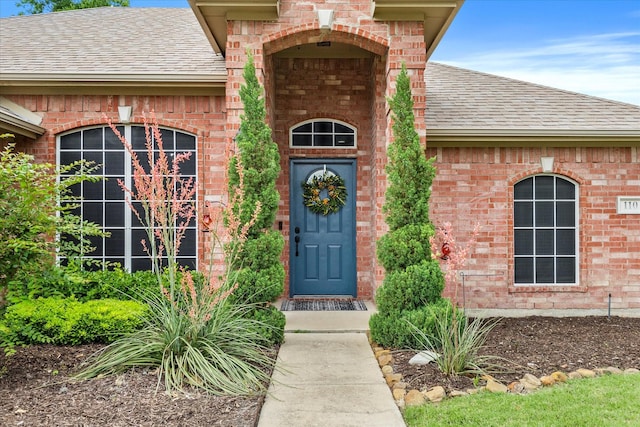 110 Stanford, Forney, TX 75126 - property entrance featuring roof with shingles and brick siding