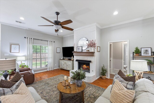 110 Stanford, Forney, TX 75126 - living room featuring a ceiling fan, wood finished floors, crown molding, a fireplace, and baseboards