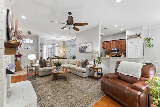 110 Stanford, Forney, TX 75126 - living room with a ceiling fan, ornamental molding, light wood-style floors, recessed lighting, and a fireplace