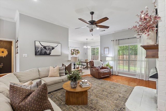 110 Stanford, Forney, TX 75126 - living room featuring ceiling fan, ornamental molding, wood finished floors, and a chandelier