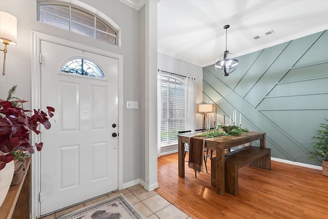 110 Stanford, Forney, TX 75126 - entrance foyer with crown molding, healthy amount of natural light, a chandelier, and baseboards