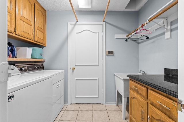 10201 Buffalo Grove Rd, Fort Worth, TX 76108 - washroom with independent washer and dryer, light tile patterned floors, cabinet space, and baseboards