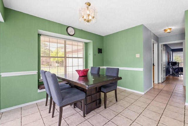 10201 Buffalo Grove Rd, Fort Worth, TX 76108 - dining space featuring a chandelier, baseboards, and light tile patterned floors