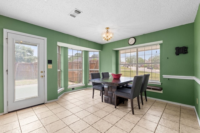 10201 Buffalo Grove Rd, Fort Worth, TX 76108 - dining space featuring plenty of natural light, a chandelier, baseboards, and a textured ceiling