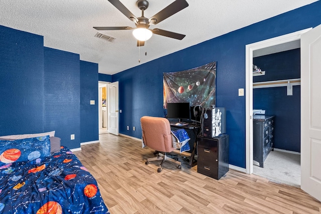 10201 Buffalo Grove Rd, Fort Worth, TX 76108 - bedroom with wood finished floors, a textured ceiling, an office area, ceiling fan, and baseboards