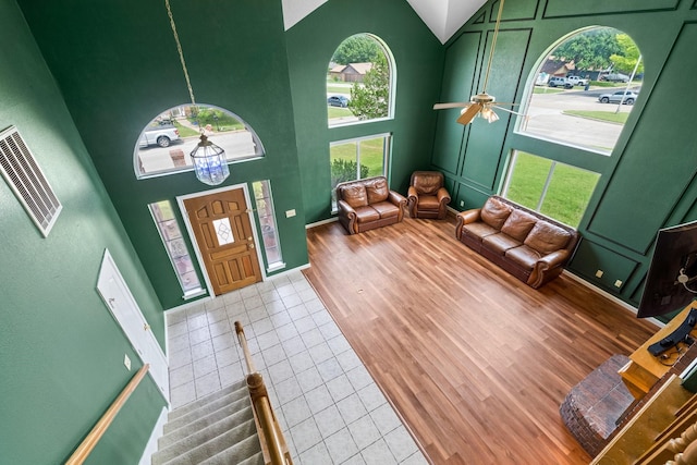 10201 Buffalo Grove Rd, Fort Worth, TX 76108 - foyer entrance featuring high vaulted ceiling, tile patterned floors, ceiling fan, and baseboards