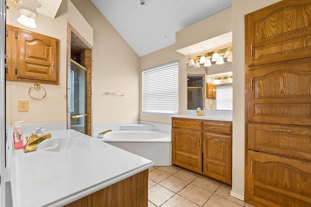 10201 Buffalo Grove Rd, Fort Worth, TX 76108 - bathroom with a shower stall, vaulted ceiling, tile patterned floors, a garden tub, and two vanities