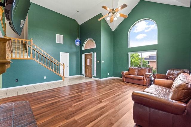 10201 Buffalo Grove Rd, Fort Worth, TX 76108 - living room featuring wood finished floors, stairs, high vaulted ceiling, a ceiling fan, and baseboards