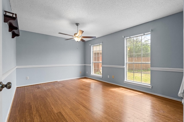 10201 Buffalo Grove Rd, Fort Worth, TX 76108 - spare room featuring wood finished floors, a textured ceiling, ceiling fan, and baseboards